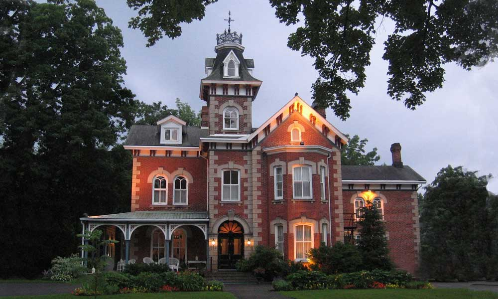 Historic red brick King West Apartments building with its central tower
